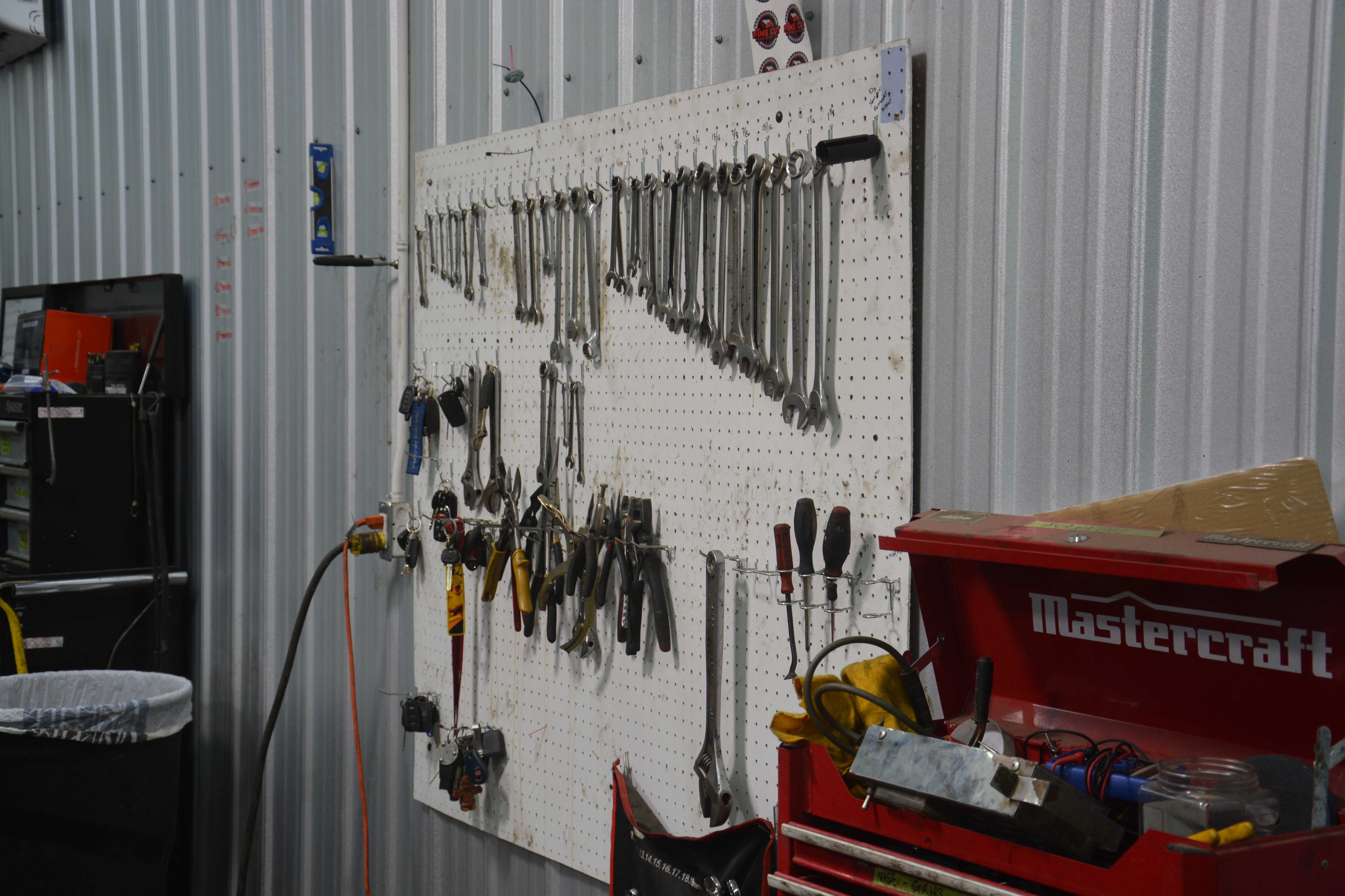 Organized tool wall with professional equipment